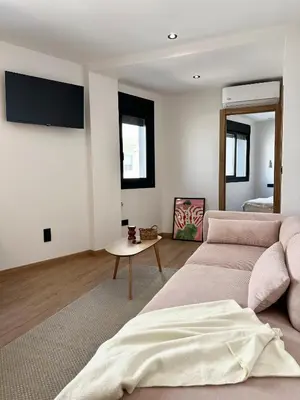 a living room with a couch and a table at Lemos Sía in Monforte de Lemos