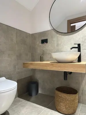 a bathroom with a sink and a toilet at Lemos Agra in Monforte de Lemos