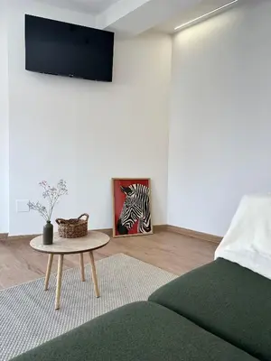 a living room with a couch and a table at Lemos Agra in Monforte de Lemos