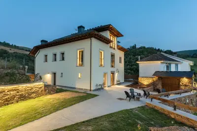 a villa with a view of a house at La Rectoral de Besullo in Besullo