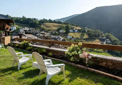 a group of white chairs sitting on top of a hill at La Rectoral de Besullo in Besullo
