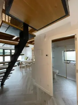 a large room with a kitchen and a dining room at La Higuera in Cacabelos