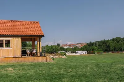 a small house with a gazebo in a field at Cabañas de Allariz - Cabaña 5 in Allariz