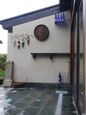 a wall with a clock and lights on it at Albergue la Medina de Camponaraya in Camponaraya
