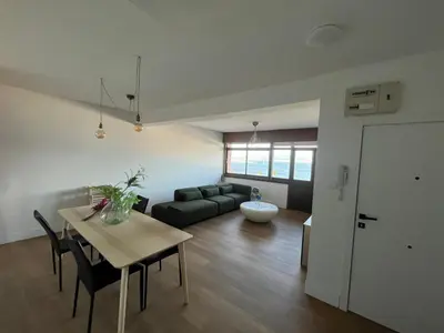 a living room with a table and a couch at cospeito in Sada
