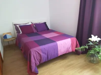 a bed in a room with purple and purple sheets at cospeito in Sada