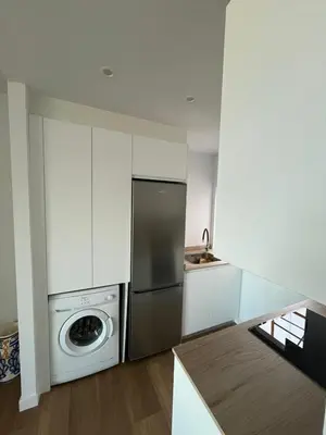 a kitchen with a stainless steel refrigerator and a dishwasher at cospeito in Sada