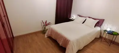 a bedroom with a large white bed with pillows at cospeito in Sada