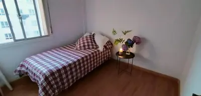 a small bedroom with a bed and a window at cospeito in Sada
