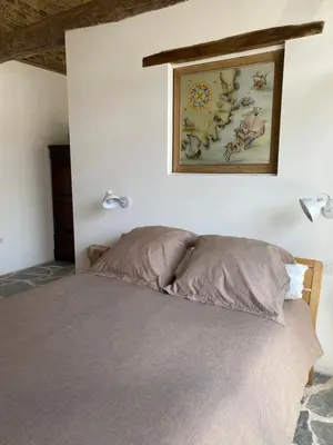 a bedroom with a bed with a picture on the wall at Casa costa de Lugo frente al mar in Nois