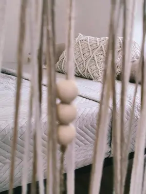 a white bed with white sheets and pillows at Casa de Pedra in Melide
