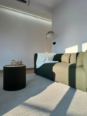 a living room with a couch and a table at Lemos Nai in Monforte de Lemos