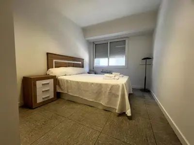 a bedroom with a bed and a window at Luz y Calma junto a la Catedral in Santiago de Compostela