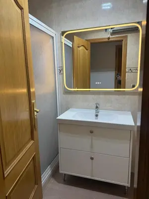 a bathroom with a sink and a mirror at Apartamento Lugo Muralla in Lugo