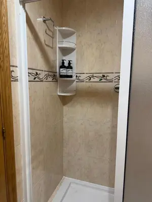 a bathroom with a shower with a glass door at Apartamento Lugo Muralla in Lugo