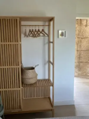 a room with a book shelf with a bowl in it at A CASIÑA dos LARANXOS in Cenlle