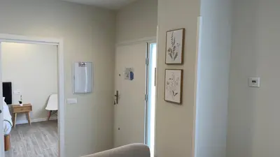 a room with a door to a room with a bed at Pension Lugo FINGOI in Lugo