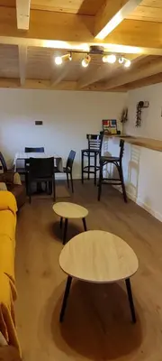 a living room with tables and a couch and tables at Costa A Mariña in Barreiros