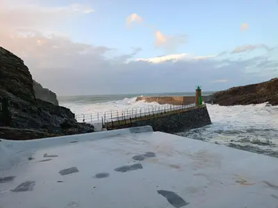 a view of a beach with the ocean and a pier at Xulia in Viavélez