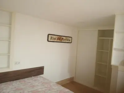 a bedroom with a bed and a sign on the wall at Xulia in Viavélez