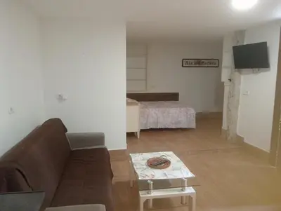 a living room with a couch and a bed at Xulia in Viavélez