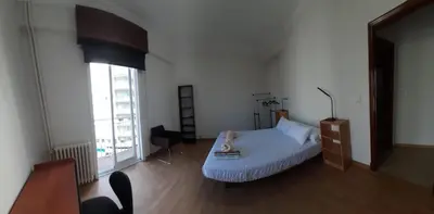 a bedroom with a bed and a large window at Mirador San Rosendo, TOP Location in Ourense