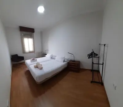 a bedroom with a bed with a teddy bear on it at Mirador San Rosendo, TOP Location in Ourense