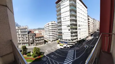 a view of a city street with tall buildings at Mirador San Rosendo, TOP Location in Ourense