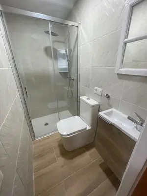 a bathroom with a shower and a toilet and a sink at CASA CRISTINA Alojamiento céntrico en pleno casco histórico y centro de la ciudad in Monforte de Lemos