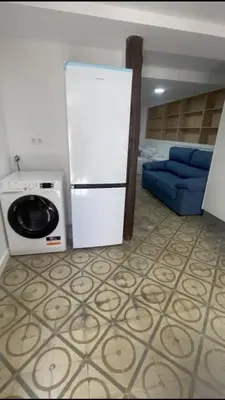 a kitchen with a white refrigerator and a microwave at CASA CRISTINA Alojamiento céntrico en pleno casco histórico y centro de la ciudad in Monforte de Lemos