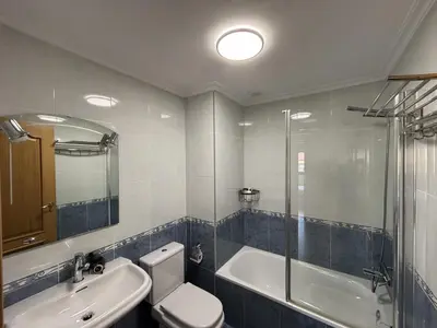 a bathroom with a toilet and a sink and a shower at Ribeira Sacra Suites in Nogueira de Ramuin