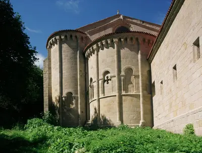 a large brick building with a tower on the side at Parador de Santo Estevo in Santo Estevo de Rivas de Sil