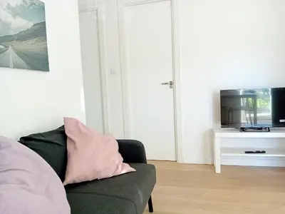 a living room with a couch and a tv at Hermosa Casa en Ribeira Sacra in Sistín