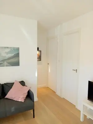 a living room with a couch and a television at Hermosa Casa en Ribeira Sacra in Sistín