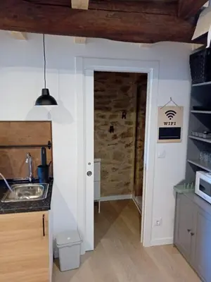 a kitchen with a sink and a counter top at Duplex en Ribeira Sacra in Sistín