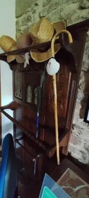 a group of straw hats on top of a table at Casa mañoso in Cea