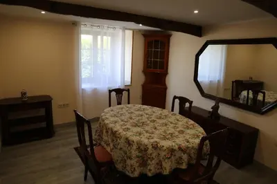a dining room with a table and a mirror at O'Regueiro