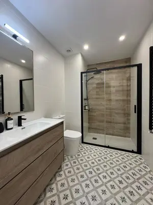 a bathroom with a tub and a toilet and a shower at Civitas Augusta in Lugo