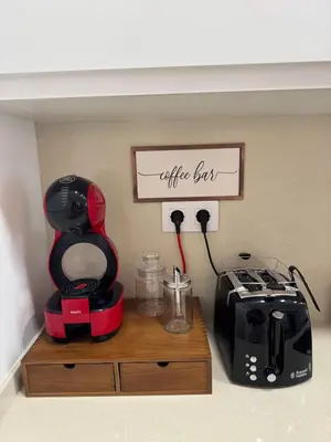 a kitchen counter with a coffee maker and a blender at Civitas Augusta in Lugo