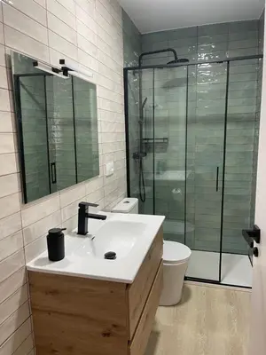 a bathroom with a sink and a shower and a toilet at Fogar en Soutelo in Forcarei