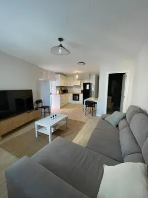 a living room with a couch and a table at Fogar en Soutelo in Forcarei
