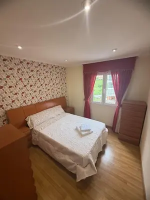 a bedroom with a bed and a window at Apartmento en Xove in Jove