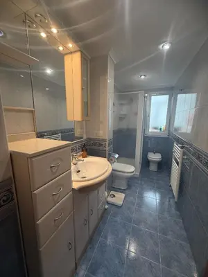 a bathroom with a sink and a toilet at Apartmento en Xove in Jove
