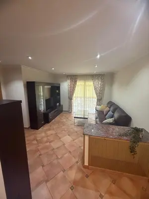 a living room with a couch and a television at Apartmento en Xove in Jove