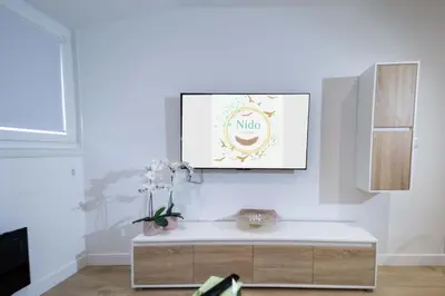 a living room with a coffee table and a picture at Nido PADRON in Padrón