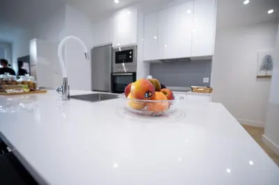 a bowl of fruit on a counter in a kitchen at Nido PADRON in Padrón