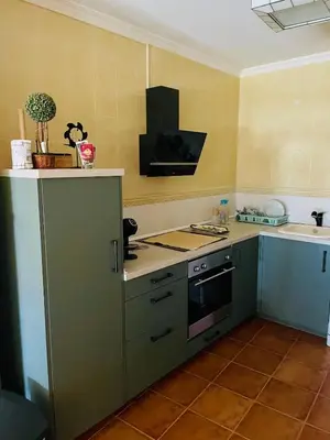 a kitchen with a stove and a sink at El mirador del mar in Foz