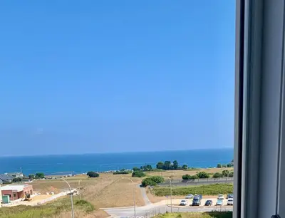 a view of the ocean from a window at El mirador del mar in Foz