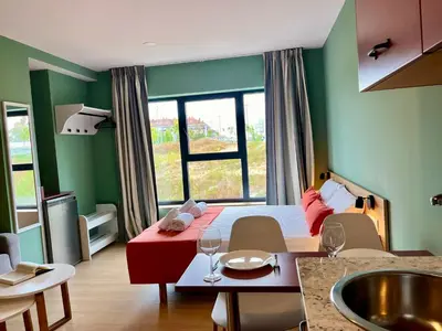 a bedroom with a bed and a large window at Luxury Singular Blue in Santiago de Compostela