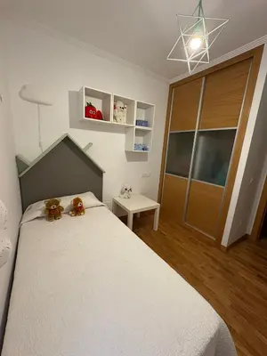 a bedroom with a bed with two teddy bears on it at Piso Rente o Mar in Foz